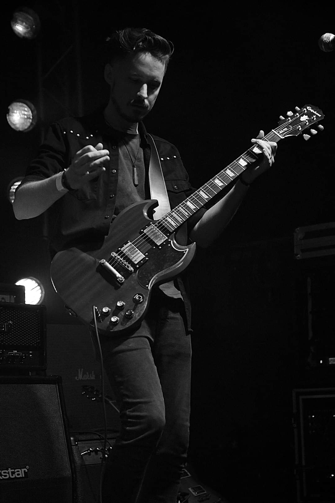 Andy playing guitar at Livewire
